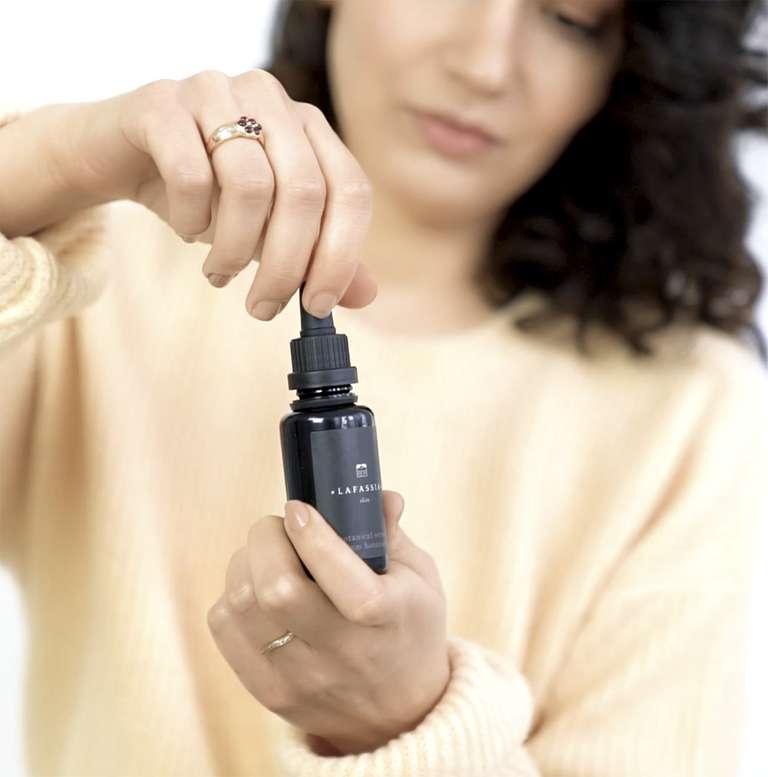 woman with Skincare bottle